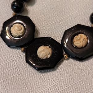 Vintage black beaded necklace with carved off white rose details